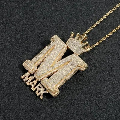 Jewellery in the catalogue: Gold 'M' Crown Pendant Necklace with 'MARK' Detail